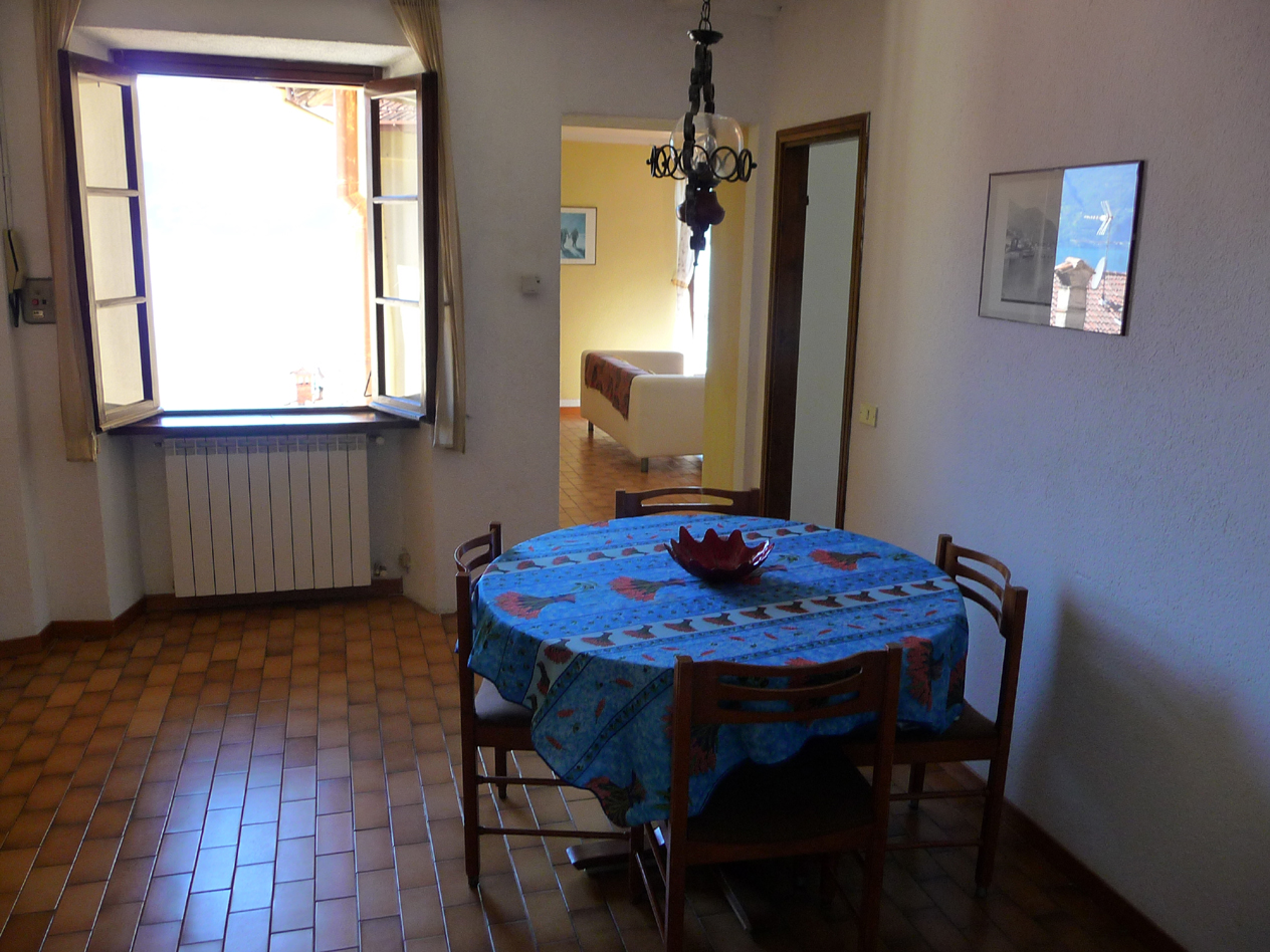 diningroom with a big table for 8 people
and window view lake